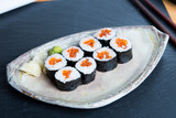 Salmon maki.
Image result for maki sushi
In Japanese, the word maki means 