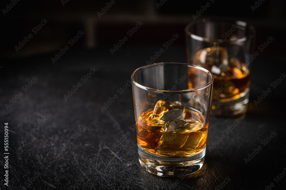 Whiskey with ice in glasses Whiskey with ice in glasses