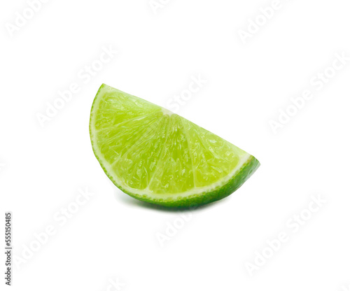 Close up photo of one slice, quarter or piece of green lemon isolated on white background with clipping path in png file format with drop shadow