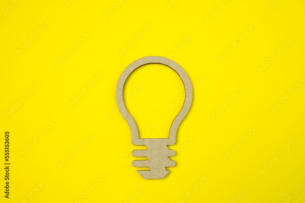 Light bulbs made with paper cut on yellow background. Business idea concept. Light bulbs made with paper cut on yellow background. Business idea concept.