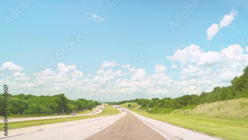 Interstate highway 82, Saint Jo Texas by cars on rural countryside road with farm field pov point of view vehicle shot