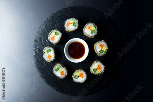 Vegan sushi hot roll. Sushi roll filled with vegetables and fried. photo