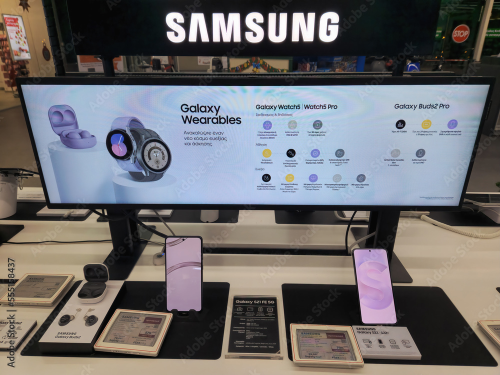 Samsung Galaxy gadgets on display inside a shop showcase, including