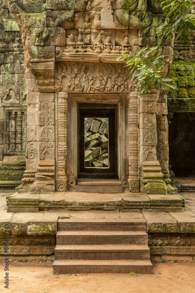 Fallen rocks seen through ruined temple entrance, Ta Prohm, Angkor Wat; Siem Reap, Siem Reap Province, Cambodia Fallen rocks seen through ruined temple entrance, Ta Prohm, Angkor Wat; Siem Reap, Siem Reap Province, Cambodia