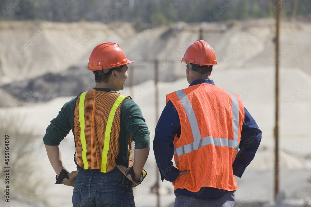 Two engineers at a gravel and asphalt plant Two engineers at a gravel and asphalt plant