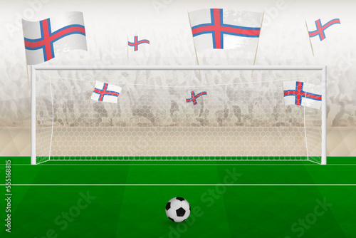 Faroe Islands football team fans with flags of Faroe Islands cheering on stadium, penalty kick concept in a soccer match.
