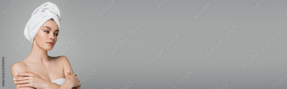 young woman with bare shoulders and towel on head standing with crossed arms isolated on grey, banner young woman with bare shoulders and towel on head standing with crossed arms isolated on grey, banner