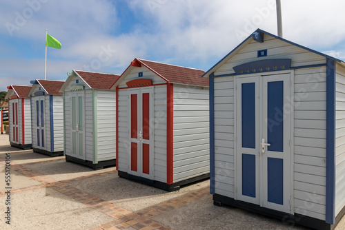 A row of small colored wooden cabins