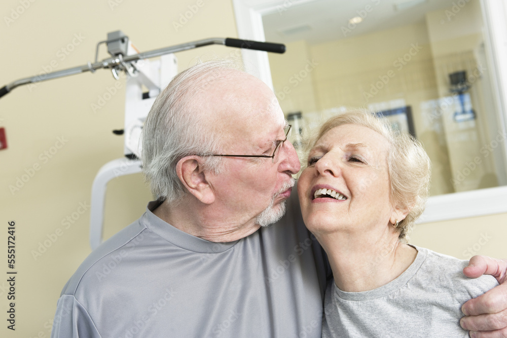 Senior couple smiling in the gym. Senior couple smiling in the gym.