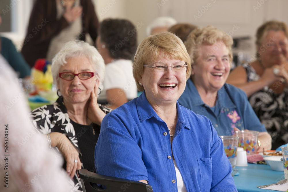 Senior women laughing at a luncheon Senior women laughing at a luncheon