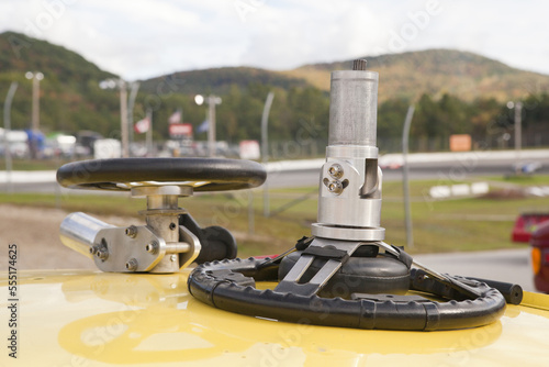 Practice wheel for hand controlled simulator on the top of a stock car for racing photo