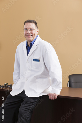 Portrait of an audiologist in his office photo