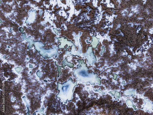 Aerial top down view of natural wetlands in winter.