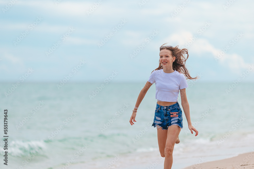 Happy young girl enjoy tropical beach vacation