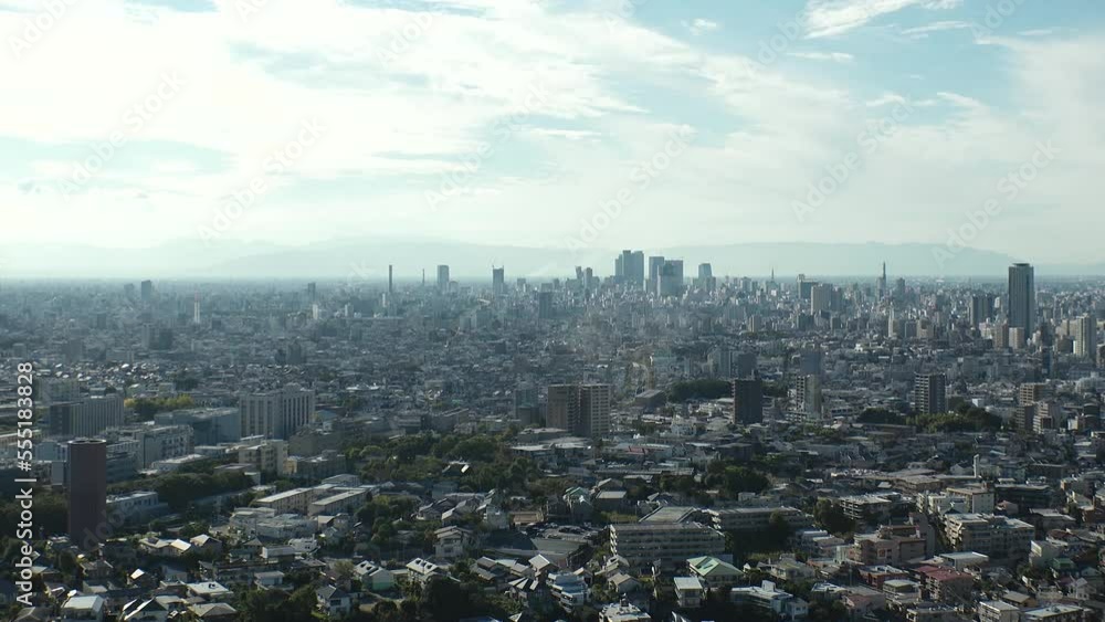 NAGOYA, JAPAN - OCTOBER 2022 : Aerial high angle view of NAGOYA CITY in sunny daytime. View of buildings and street traffic around Nagoya station and Sakae area (central downtown). Time lapse shot. NAGOYA, JAPAN - OCTOBER 2022 : Aerial high angle view of NAGOYA CITY in sunny daytime. View of buildings and street traffic around Nagoya station and Sakae area (central downtown). Time lapse shot.