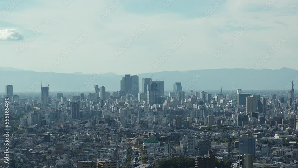 NAGOYA, JAPAN - OCTOBER 2022 : Aerial high angle view of NAGOYA CITY in sunny daytime. View of buildings and street traffic around Nagoya station and Sakae area (central downtown). Time lapse shot. NAGOYA, JAPAN - OCTOBER 2022 : Aerial high angle view of NAGOYA CITY in sunny daytime. View of buildings and street traffic around Nagoya station and Sakae area (central downtown). Time lapse shot.