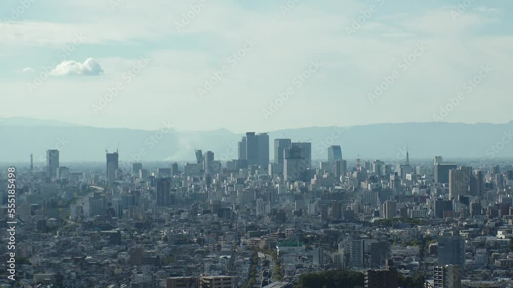 NAGOYA, JAPAN - OCTOBER 2022 : Aerial high angle view of NAGOYA CITY in sunny daytime. View of buildings and street traffic around Nagoya station and Sakae area (central downtown). Time lapse shot. NAGOYA, JAPAN - OCTOBER 2022 : Aerial high angle view of NAGOYA CITY in sunny daytime. View of buildings and street traffic around Nagoya station and Sakae area (central downtown). Time lapse shot.