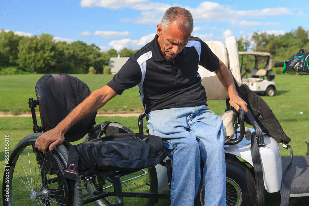 Pushing Cart Injuries Man with spinal cord injury in an adaptive golf cart getting into his ...