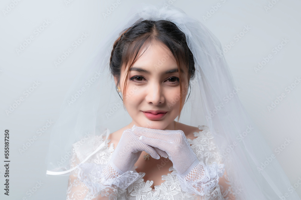 Portrait of asian woman wear bride with flower on white background,Wedding concept Portrait of asian woman wear bride with flower on white background,Wedding concept