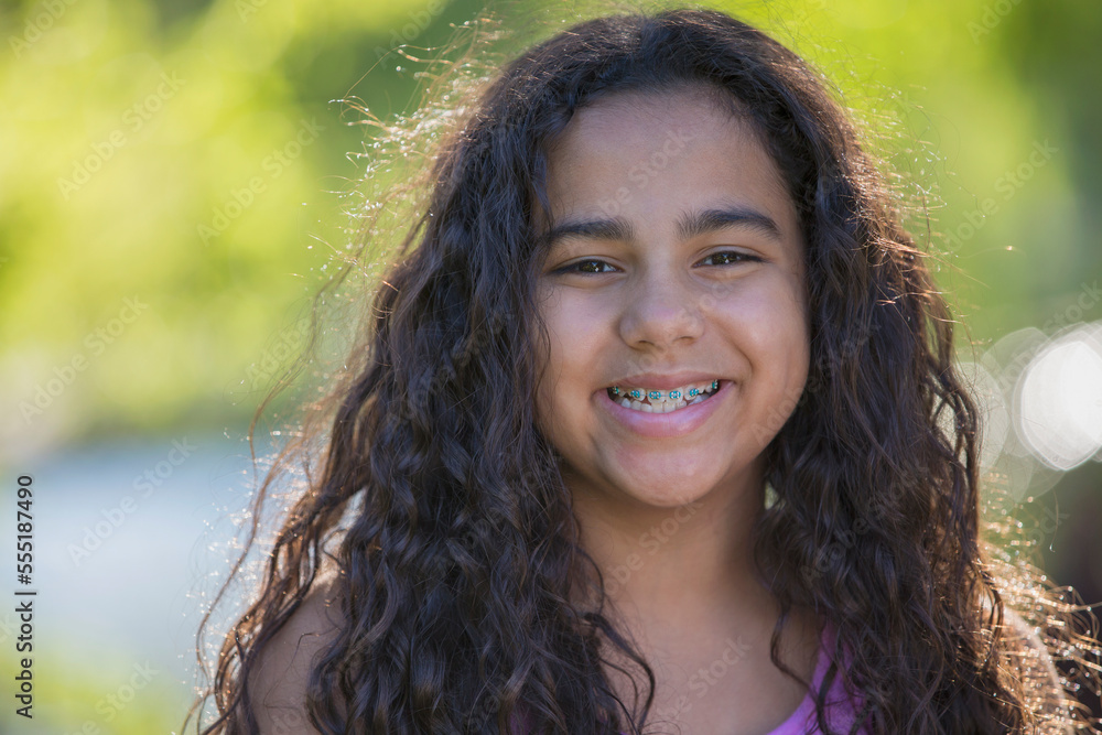 Portrait of happy Hispanic teen girl with braces Portrait of happy Hispanic teen girl with braces