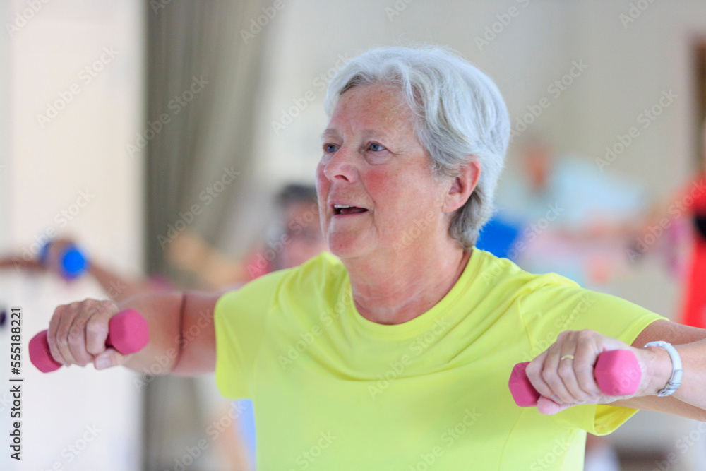 Senior woman exercising in gym Senior woman exercising in gym