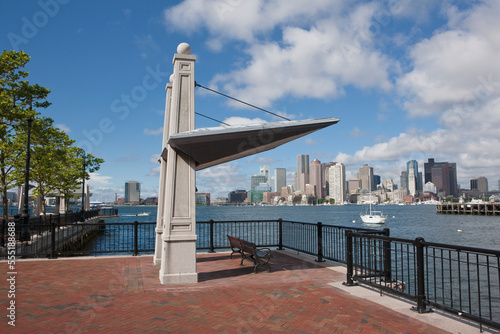 Sculpture at a harbor with city in the background, Boston Harbor, East Boston, Boston, Suffolk County, Massachusetts, USA photo