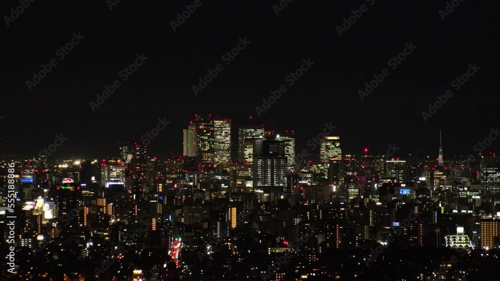 NAGOYA, JAPAN- OCT 2022 : NAGOYA CITY at night. Aerial high angle view of buildings and street traffic around Nagoya station and Sakae area (central downtown). Time lapse shot. Travel concept video. NAGOYA, JAPAN- OCT 2022 : NAGOYA CITY at night. Aerial high angle view of buildings and street traffic around Nagoya station and Sakae area (central downtown). Time lapse shot. Travel concept video.