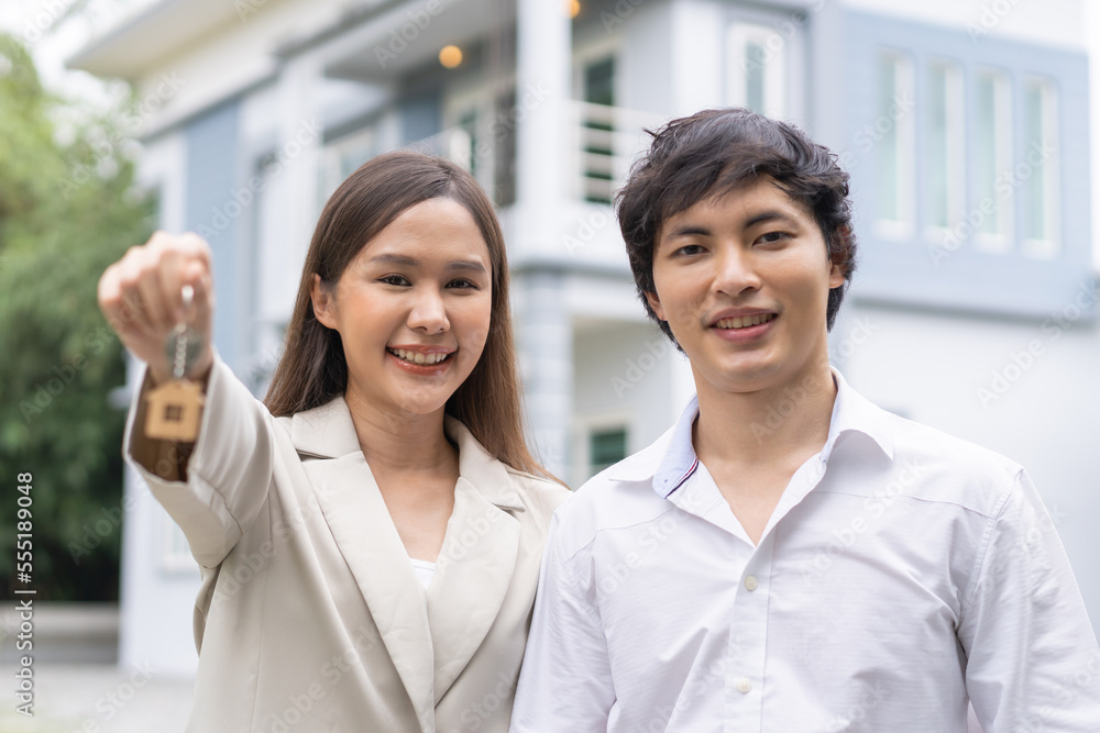 New home owner happy family asian young couple love, wife hug husband, showing house key. Banker agreement mortgage loan purchase buy, property lease real estate for relocation after married. New home owner happy family asian young couple love, wife hug husband, showing house key. Banker agreement mortgage loan purchase buy, property lease real estate for relocation after married.