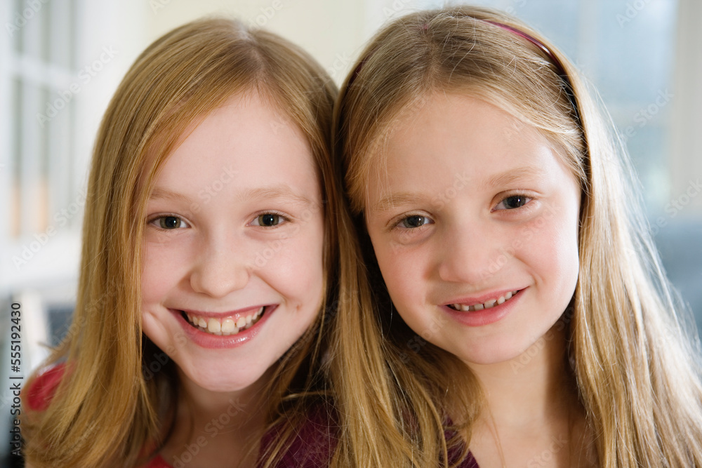 Portrait of two sisters smiling. Portrait of two sisters smiling.