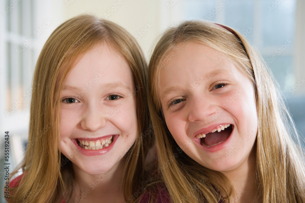 Portrait of two sisters laughing. Portrait of two sisters laughing.