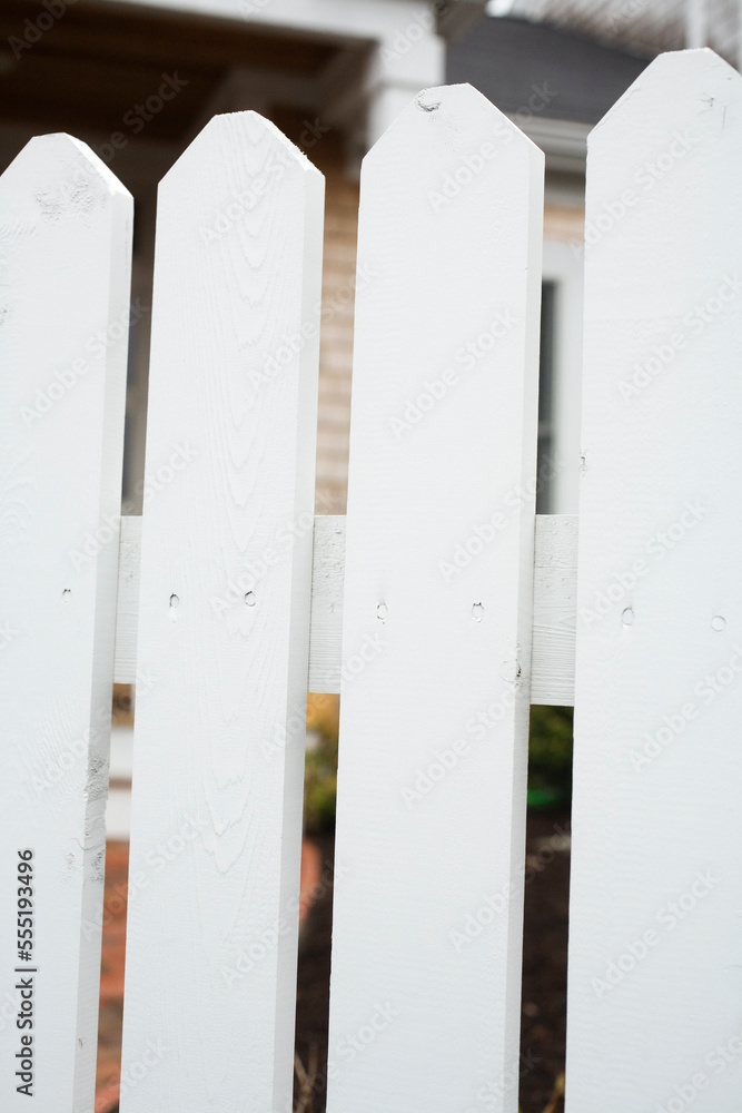 Picket fences in front of a house. Picket fences in front of a house.