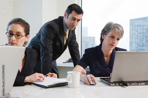 View of businesspeople working in an office.