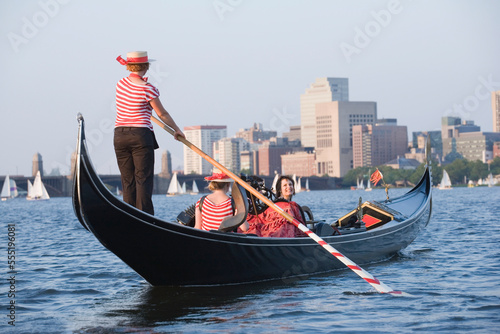 Tourists traveling in a gondola photo