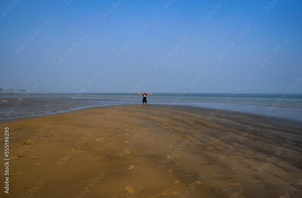 Young boy relaxing on a sea beach 