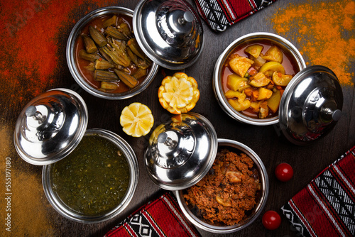 Assorted indian food with alu mutter, bhindi, keema, palak, saag and bhutta served in dish isolated on table top view of arabic food photo