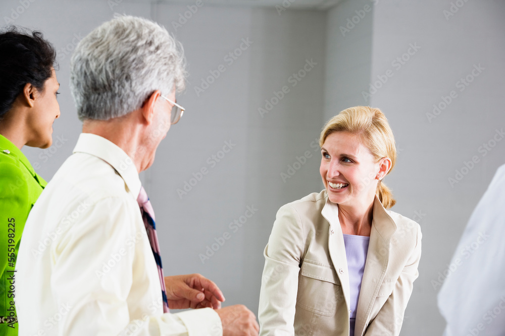 Three business colleagues in conversation. Three business colleagues in conversation.