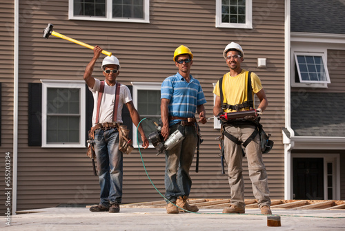 Carpenters working with construction tools photo