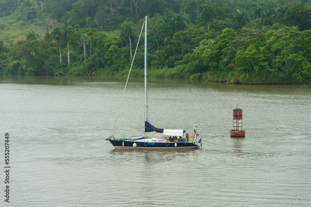Sailboat transiting the Panama canal at the Miraflores locks