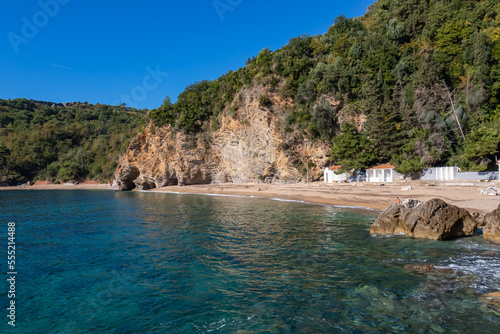 Panoramic view of the Mogren beach in the tourist coastal city of Budva  Montenegro  Adriatic Mediterranean Sea  Montenegro  Balkan  Europe. Coastline of Budvanian riviera. Summer vacation atmosphere