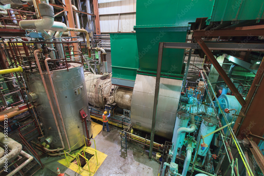 Engineer in gas turbine electric power plant exhaust gas and condensation process room Engineer in gas turbine electric power plant exhaust gas and condensation process room