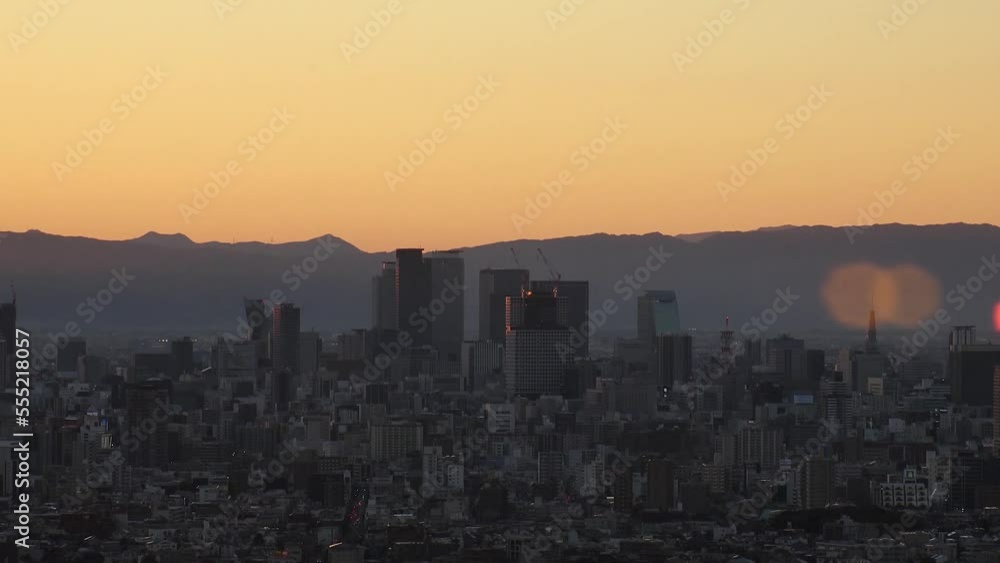 NAGOYA, JAPAN - OCTOBER 2022 : NAGOYA CITY in sunset. Aerial high angle view of buildings and street traffic around Nagoya station and Sakae area (central downtown). Time lapse shot, dusk to night. NAGOYA, JAPAN - OCTOBER 2022 : NAGOYA CITY in sunset. Aerial high angle view of buildings and street traffic around Nagoya station and Sakae area (central downtown). Time lapse shot, dusk to night.