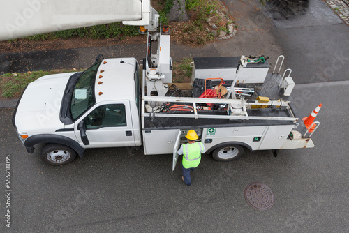 High angle view of cable lineman at bucket truck photo