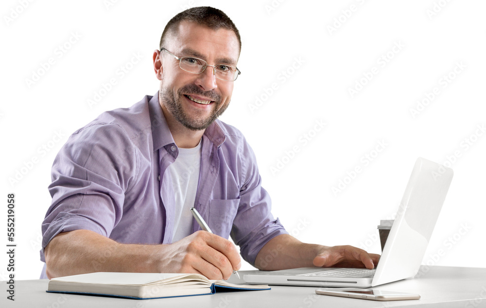 Happy cheerful businessman working on a laptop in office. Happy cheerful businessman working on a laptop in office.
