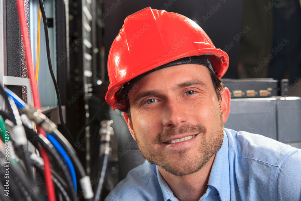 Network engineer at cable distribution patch panel Network engineer at cable distribution patch panel