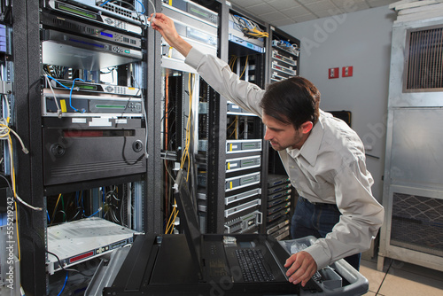 Network engineer configuring a data switch