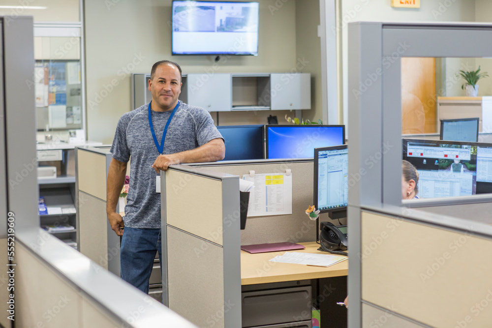 Portrait of an engineer standing at customer service center of electric power plant Portrait of an engineer standing at customer service center of electric power plant