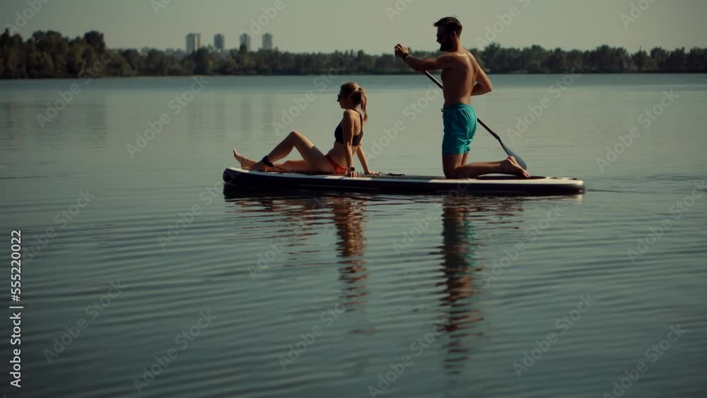 Water Sports: floating SUP paddleboarding and surfing for recreation Water Sports: floating SUP paddleboarding and surfing for recreation