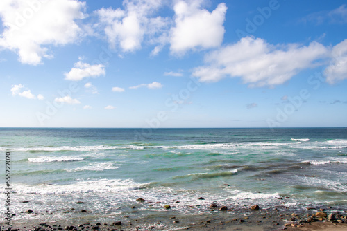 Blue Ocean, Beach, Waves Crashing and Ships in Distant in Denmark Coastline