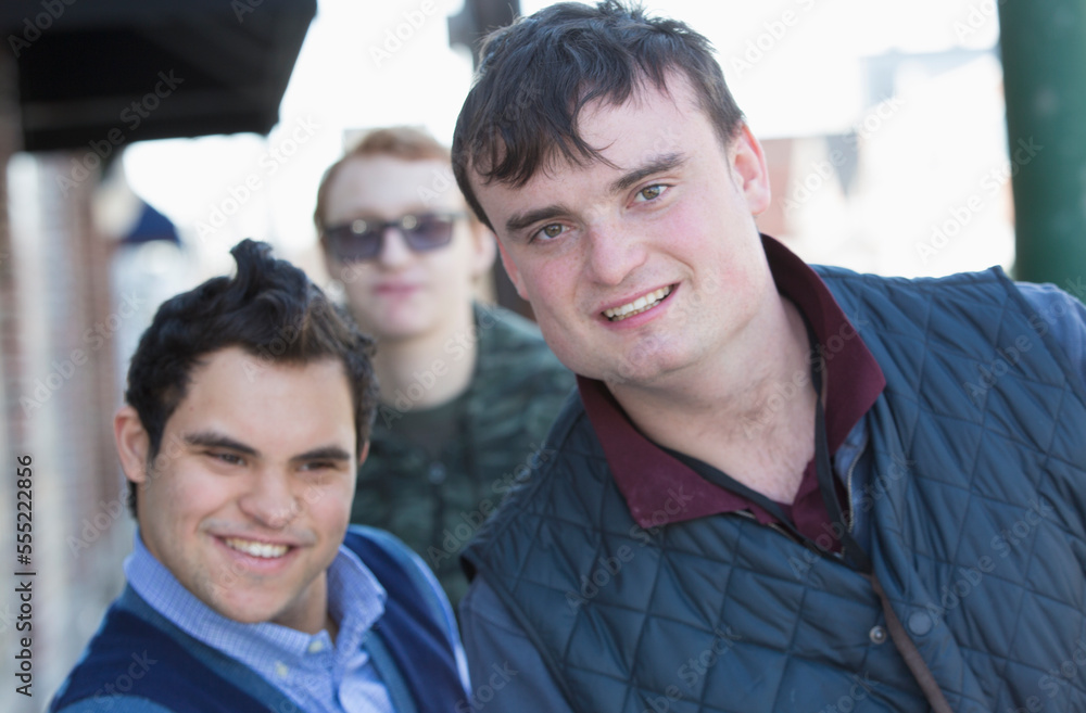 Middle Eastern man with Down Syndrome and two friends, each having a Learning Disability Middle Eastern man with Down Syndrome and two friends, each having a Learning Disability