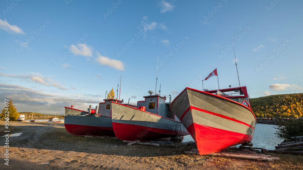 Three boats resting on the shore; Thunder Bay, Ontario, Canada Three boats resting on the shore; Thunder Bay, Ontario, Canada